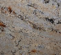 Close-up of speckled beige stone with gray and brown streaks and small dark flecks