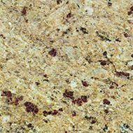 Speckled beige granite countertop surface with brown and black flecks