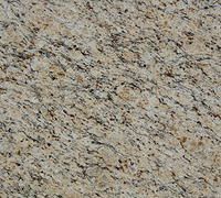 Close-up of beige and gray speckled stone surface with a rough texture