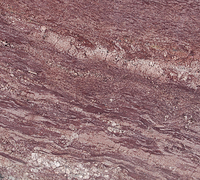 Close-up of layered pink and gray marbled stone texture