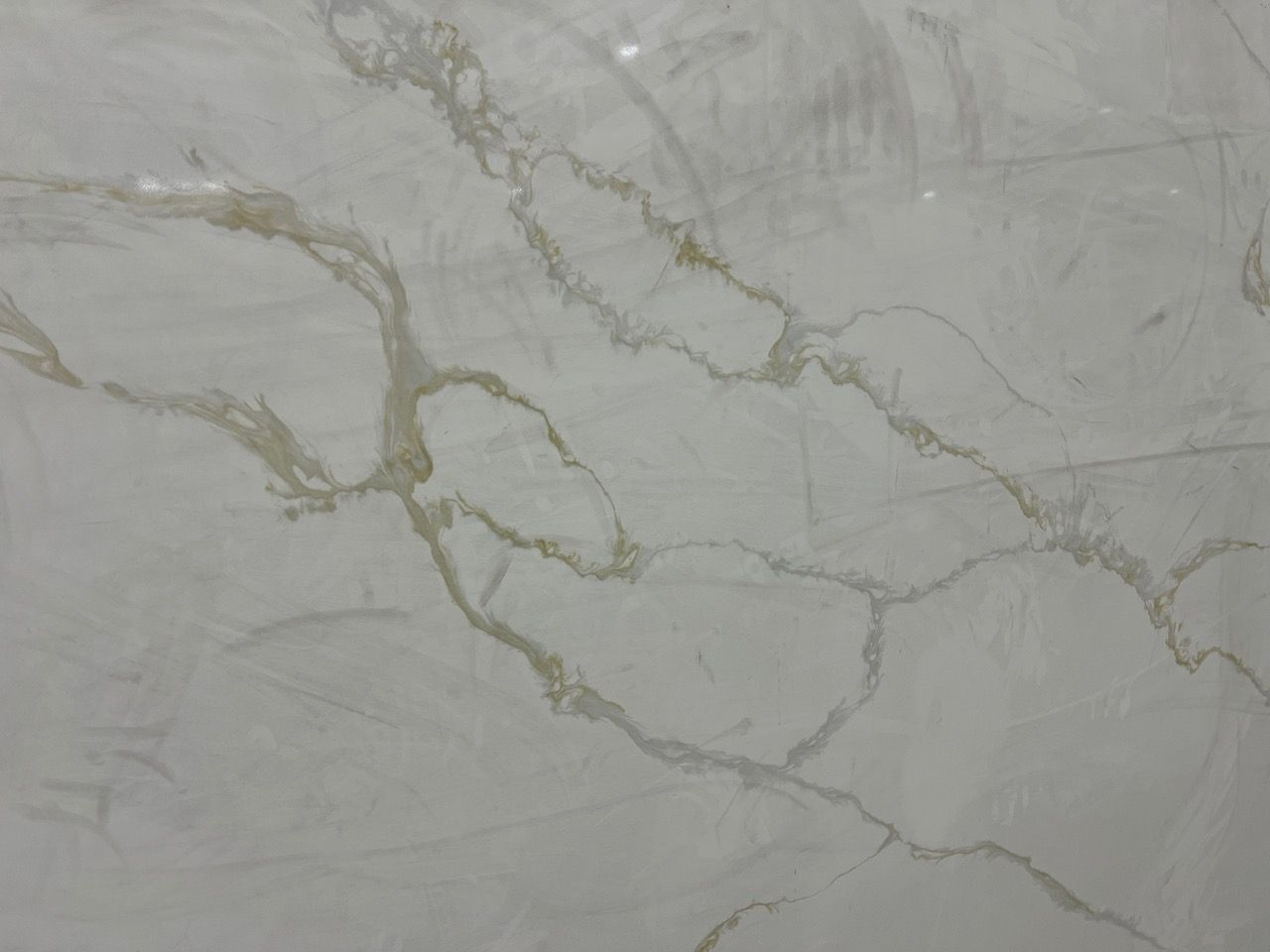 Light gray marble surface with subtle white and gold veining