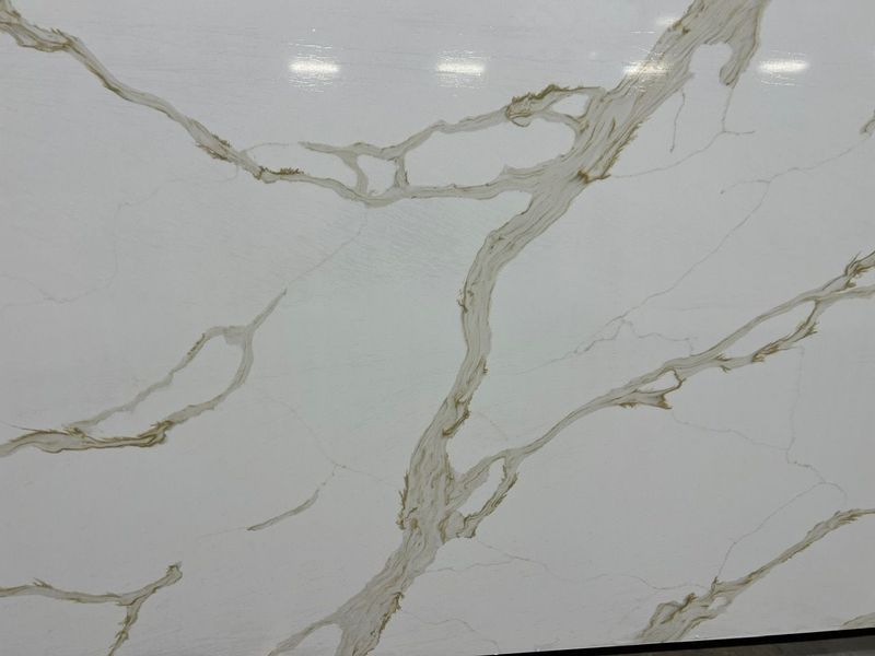 White marble tile surface with gray and gold veining