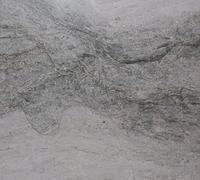 Gray marbled stone surface with dark veining and a subtle textured pattern