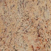 Speckled beige granite surface with black, gray, and reddish-brown flecks.