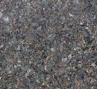 Close-up of rough gray and brown speckled stone texture