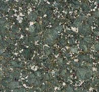 Green and beige speckled stone or granite texture with a mottled pattern