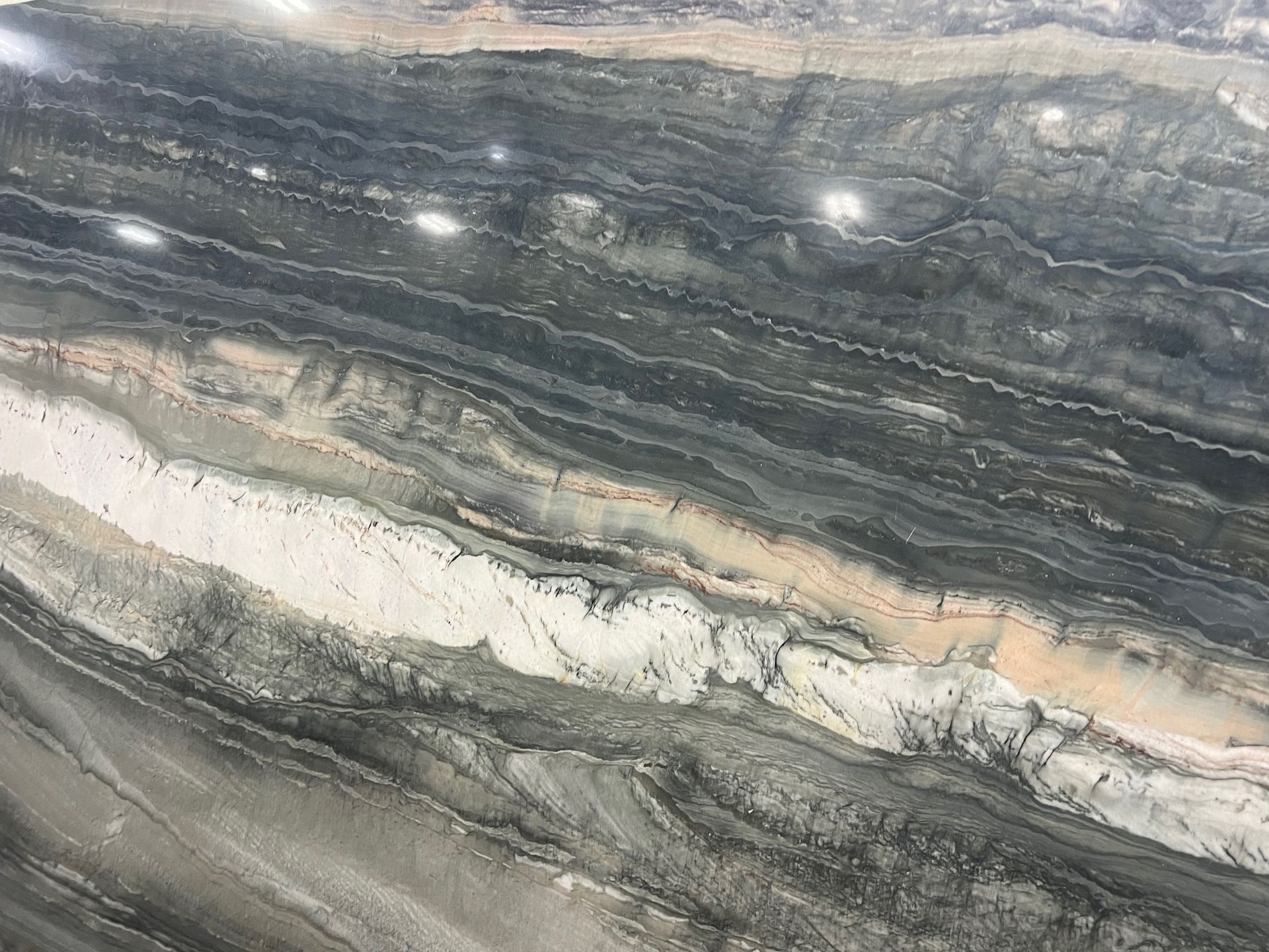 Gray and white veined marble with flowing layered patterns