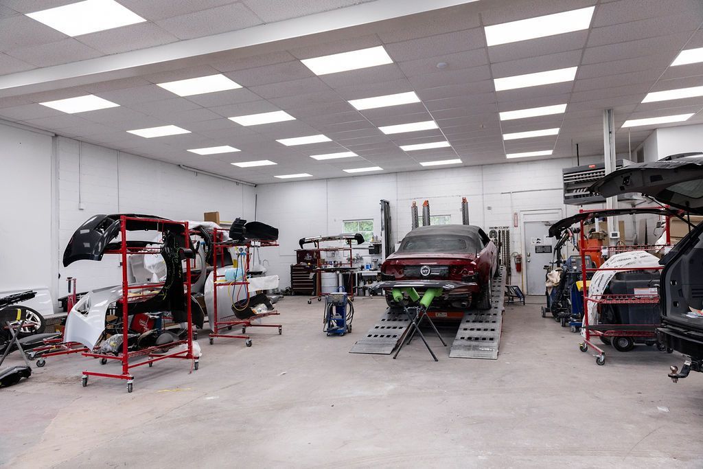 A car is being worked on in a garage.