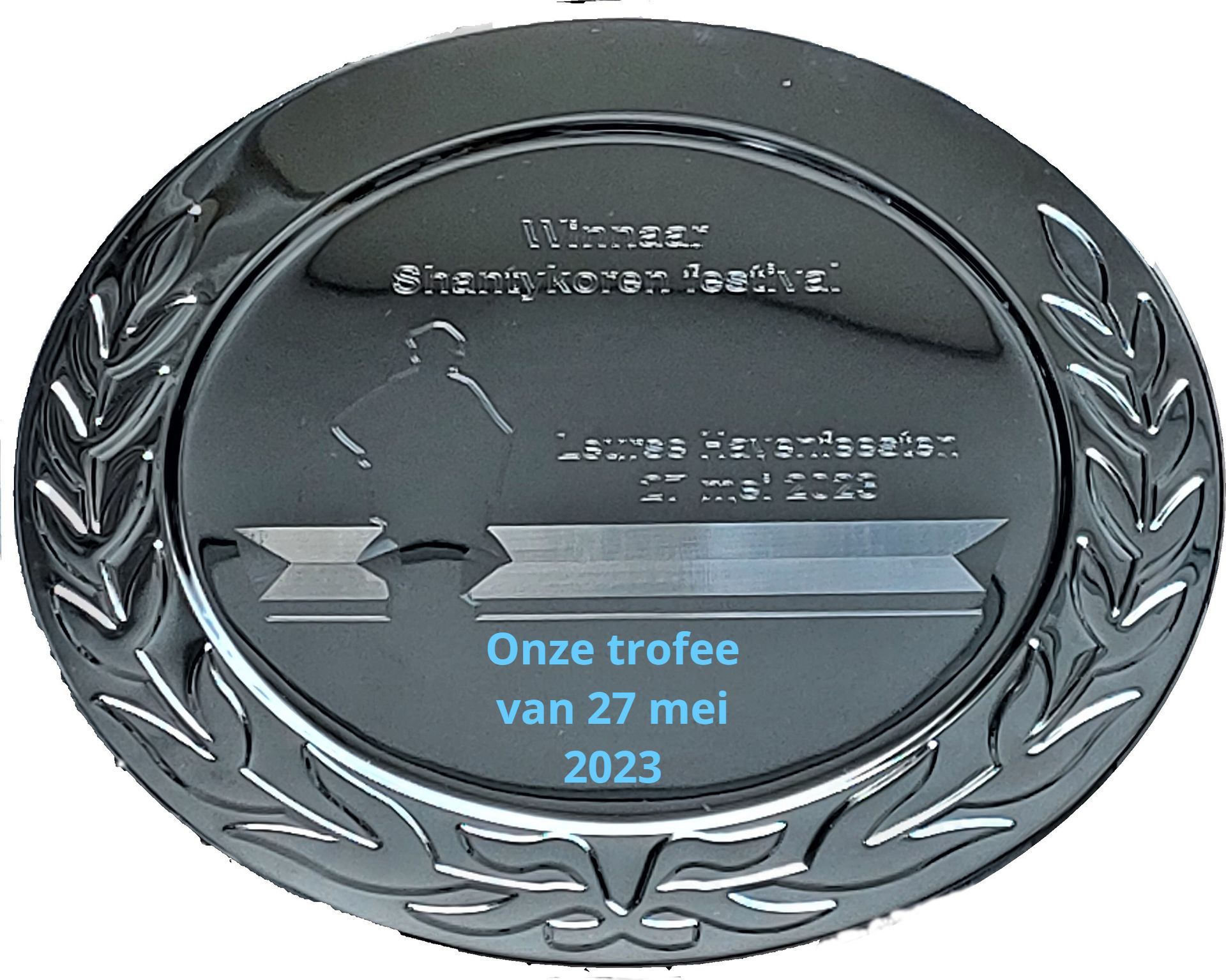 A silver circular medal engraved with 