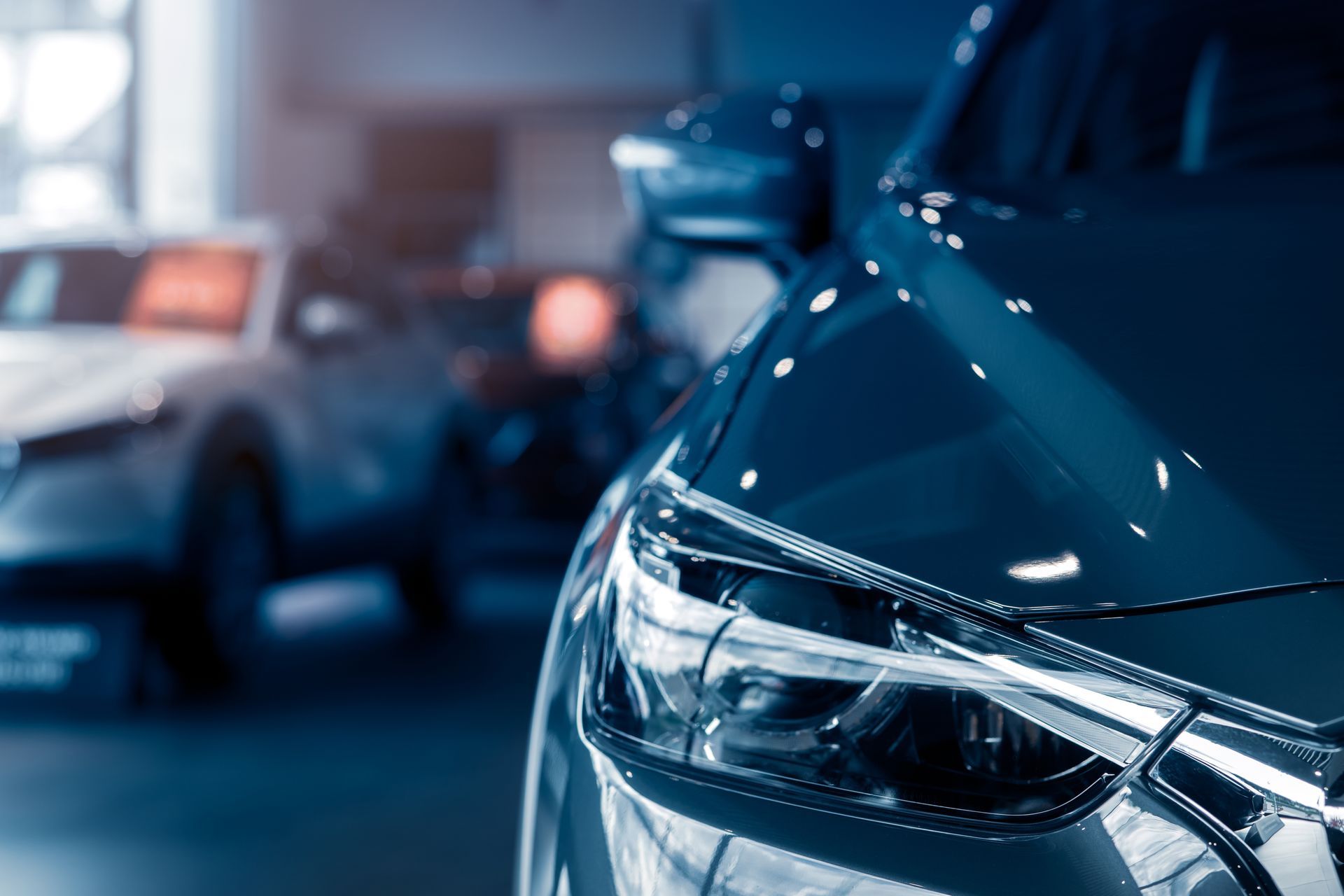 A close up of a car in a showroom | Midwest Truck and Tire