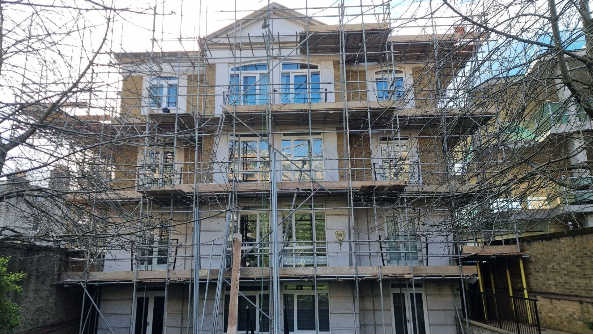 Doff cleaning natural stone and brickwork of block of apartments chelsea