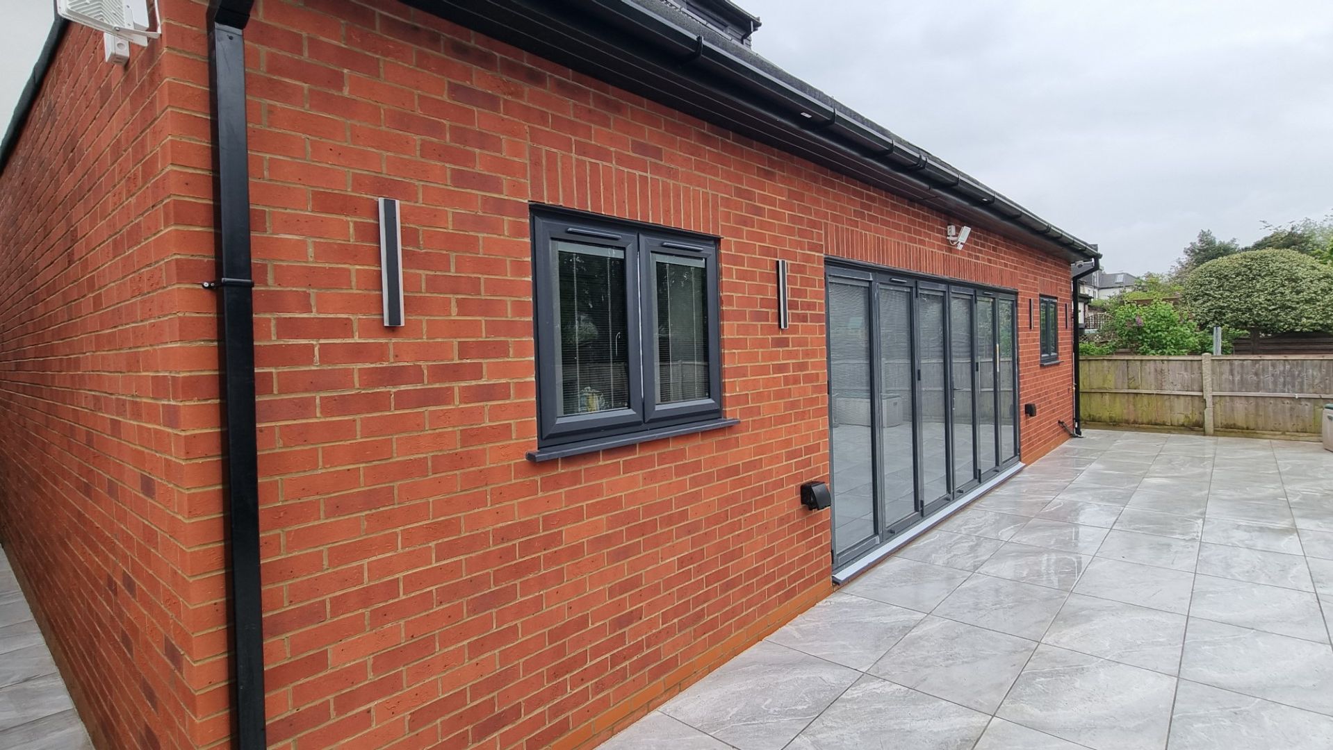 doff cleaning brickwork rear of residential house