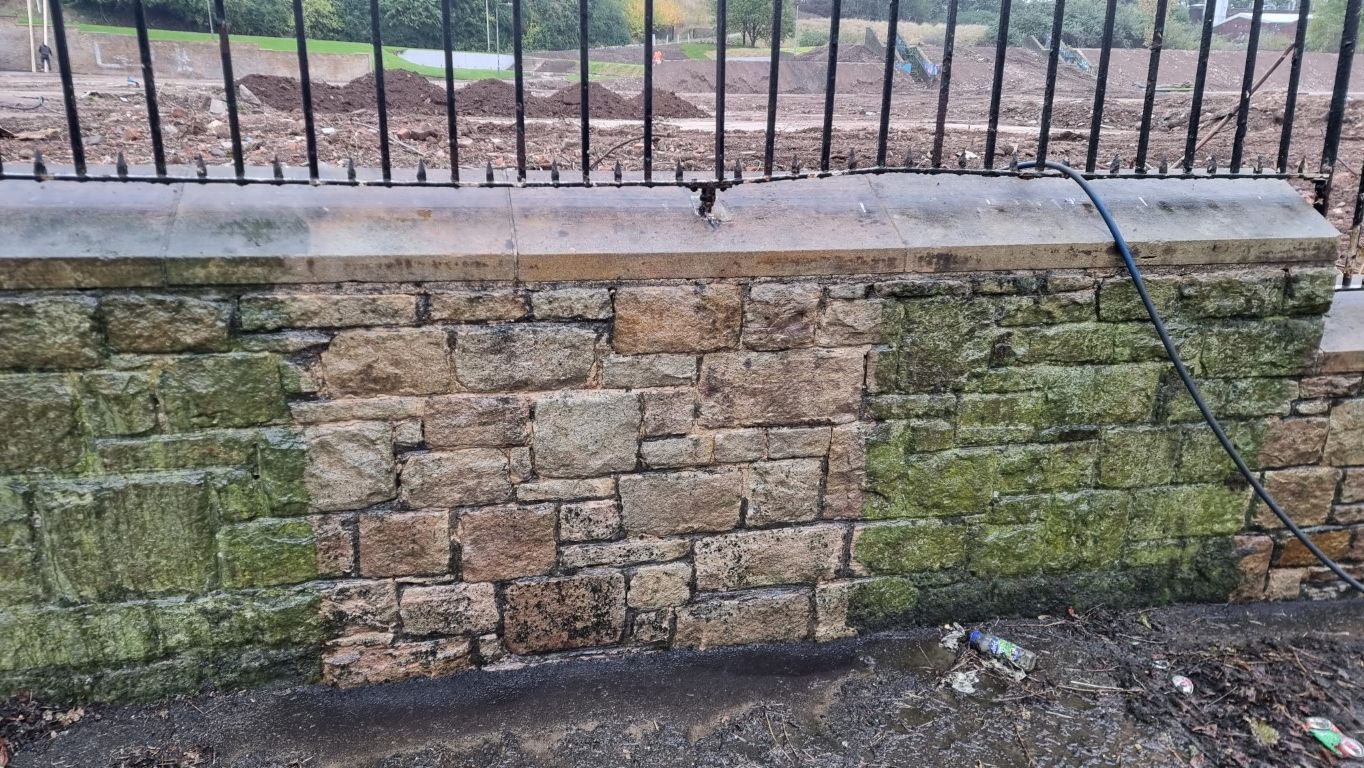 Moss and algae partial doff clean from sandstone wall