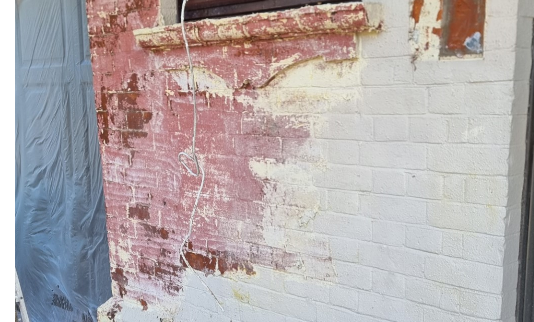 multiple layers paint on brickwork