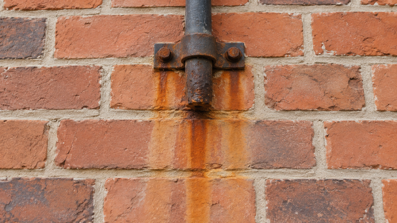rust and iron staining on brickwork