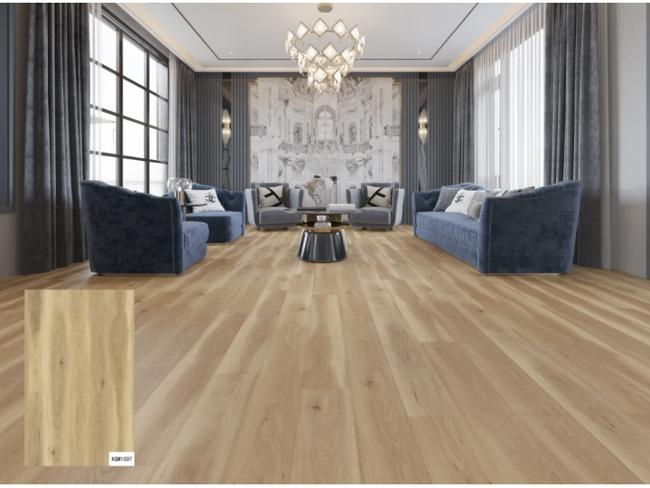 Living room with wood flooring, blue velvet sofas, and a decorative chandelier.