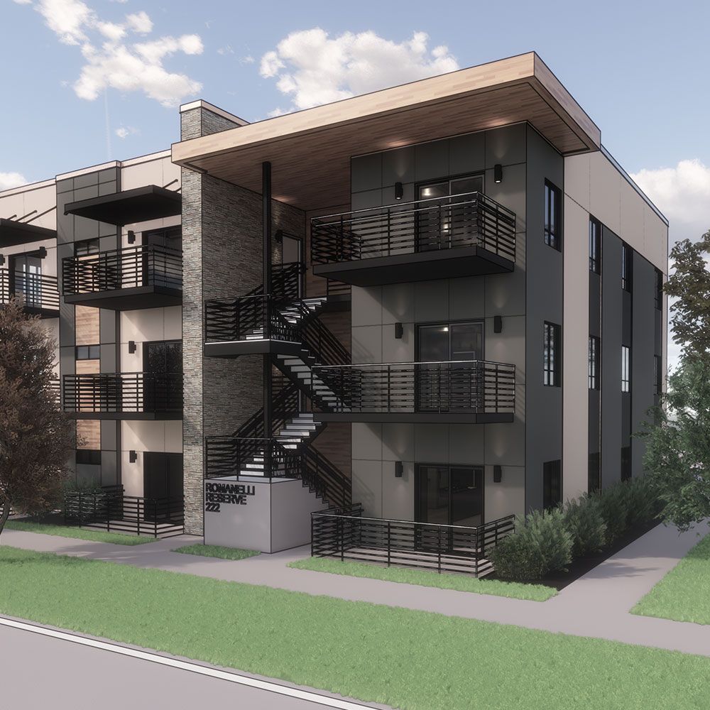 Multi-story apartment building with exterior stairwell and balconies; dark gray and brick facade.