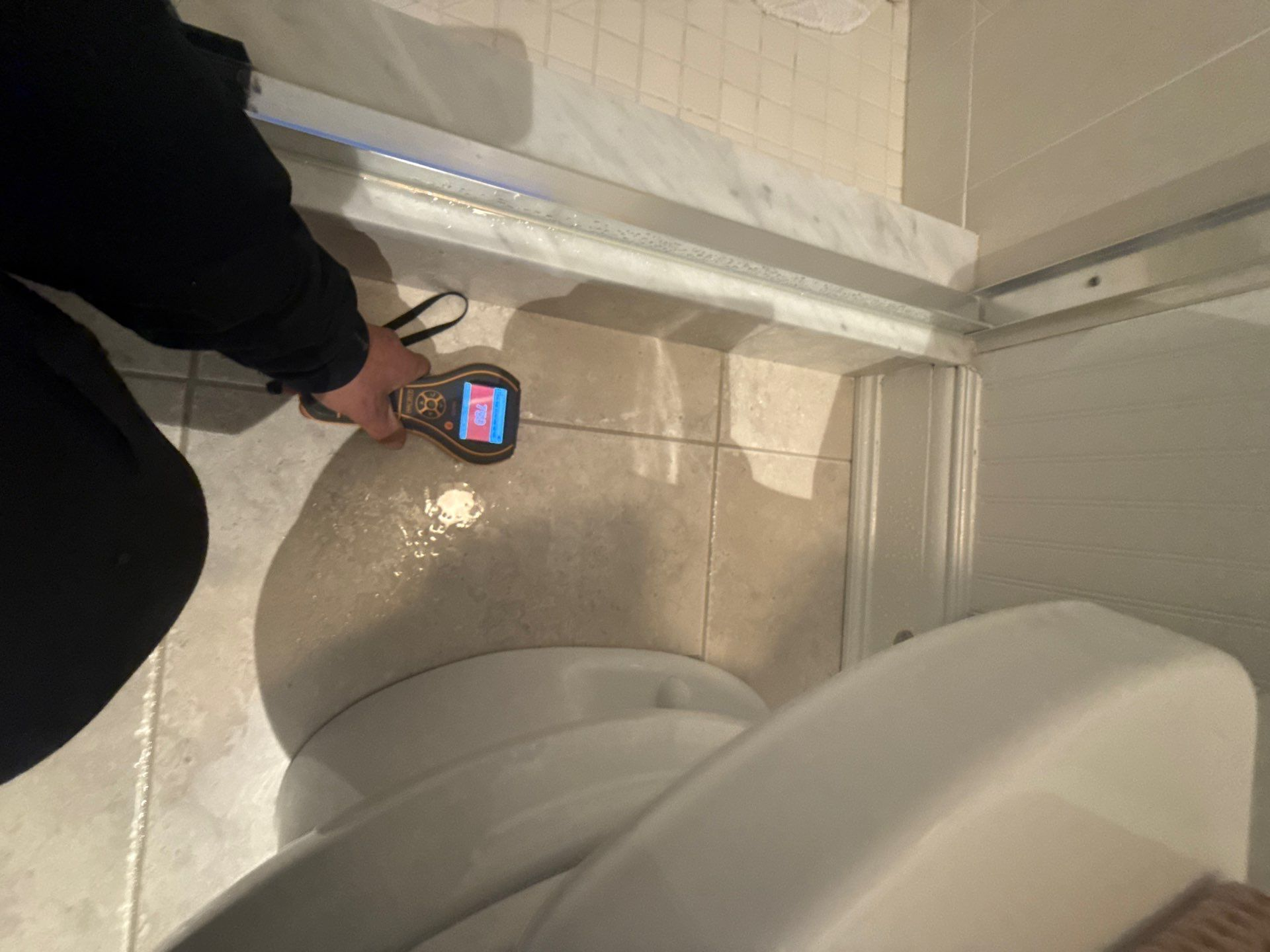 taking moisture readings at a home in Quogue NY