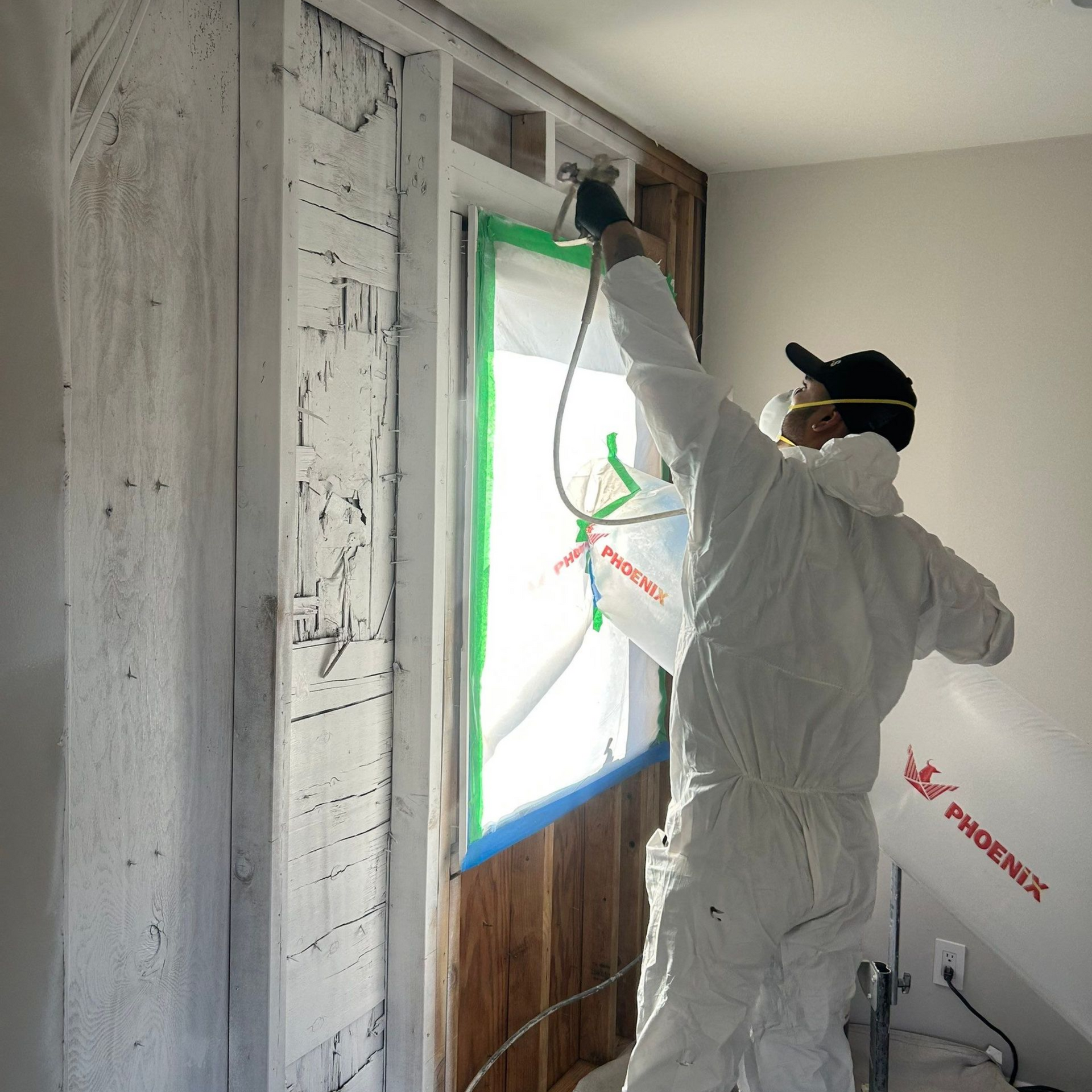 applying mold encapsulation at a home in Greenlawn New York.