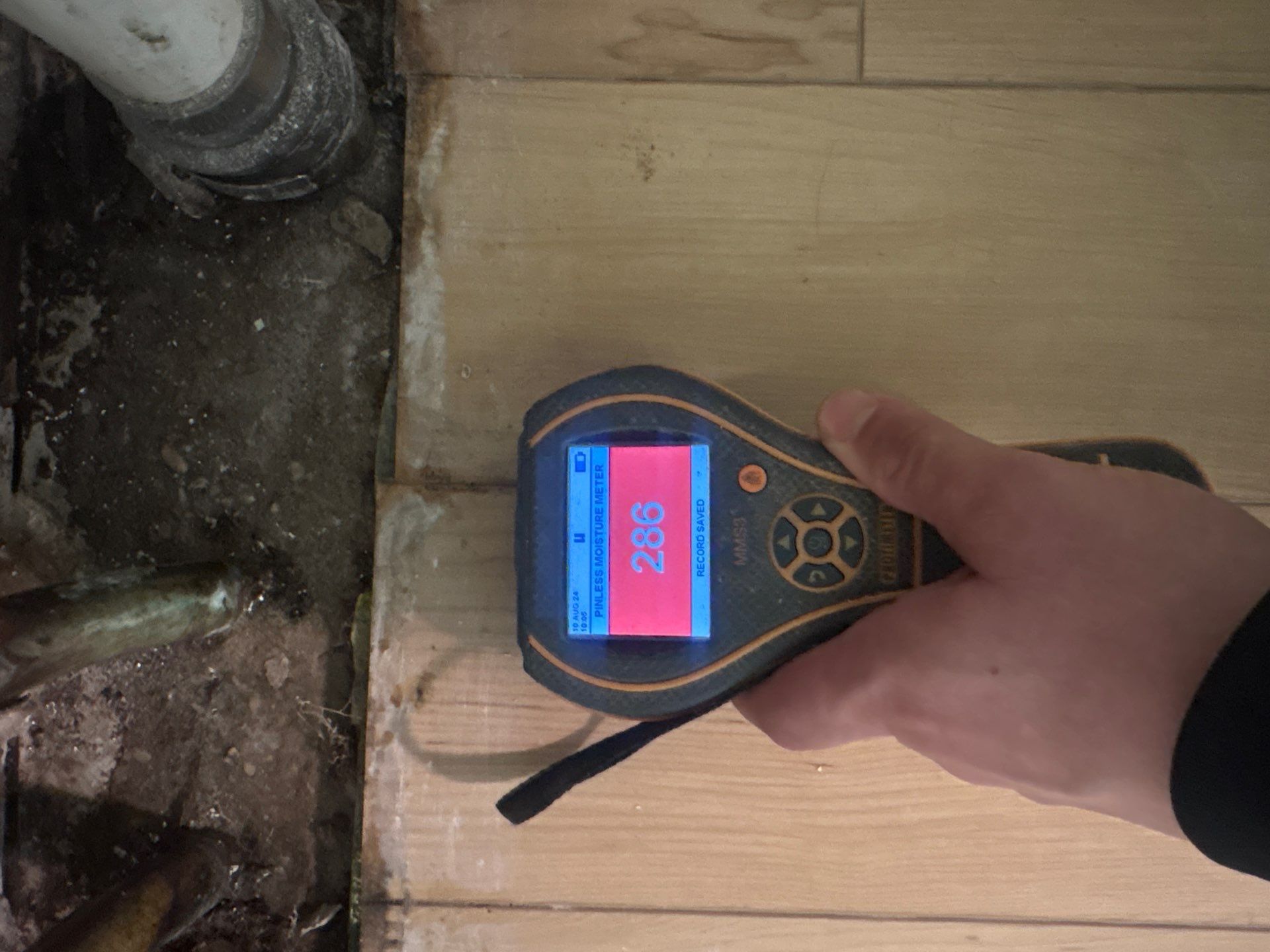 Moisture reading of flooring at a home in Stony Brook NY