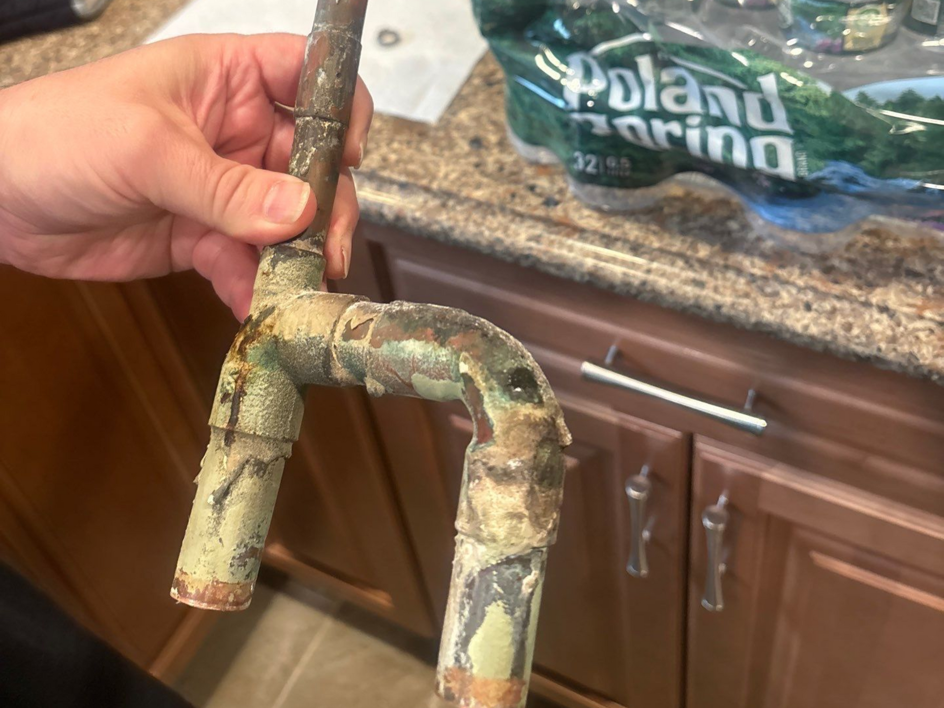 corroded pipe that burst in the wall of a home in Stony Brook NY