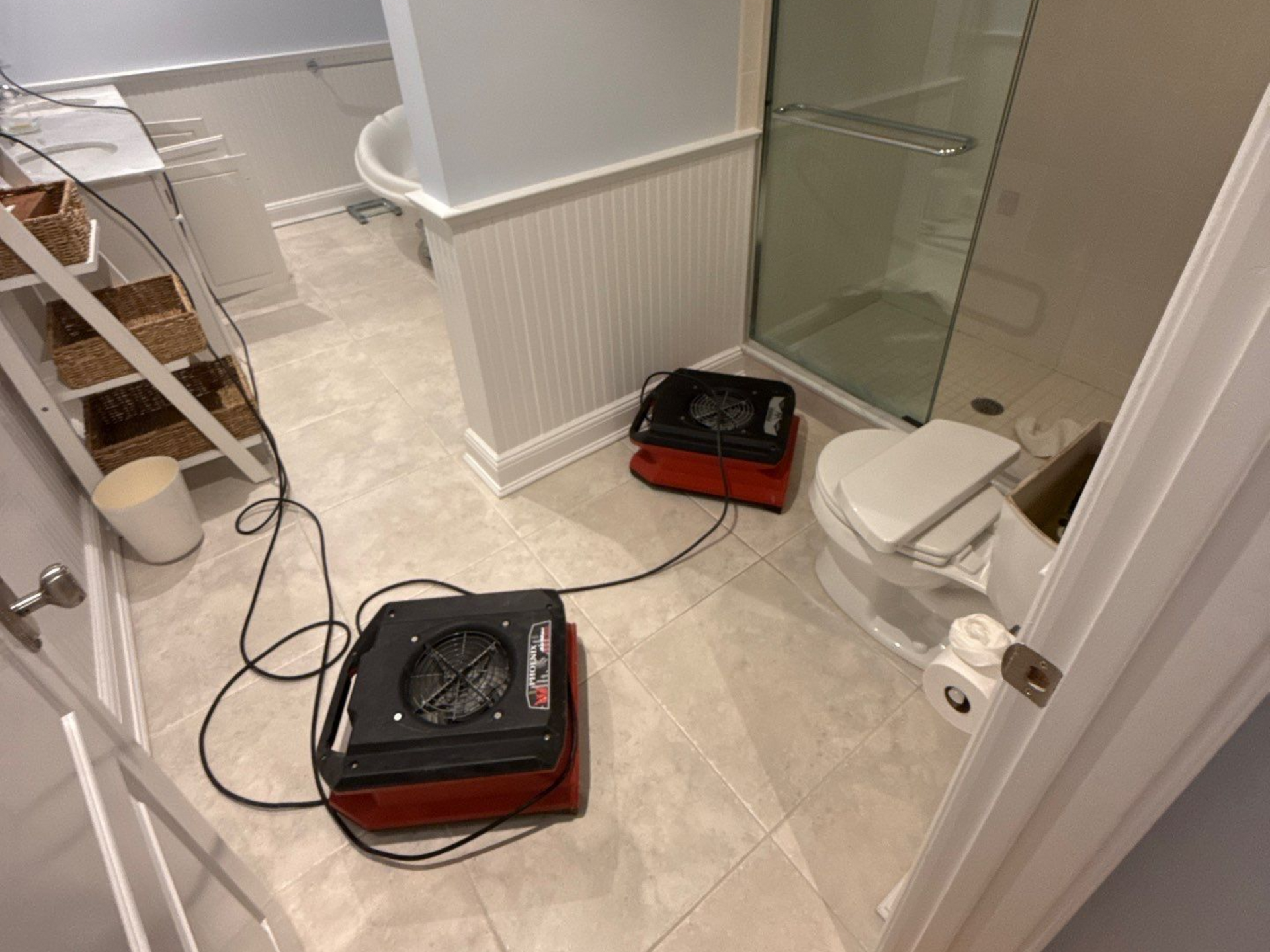 drying and dehumidifying equipment in bathroom at a home in Quogue NY