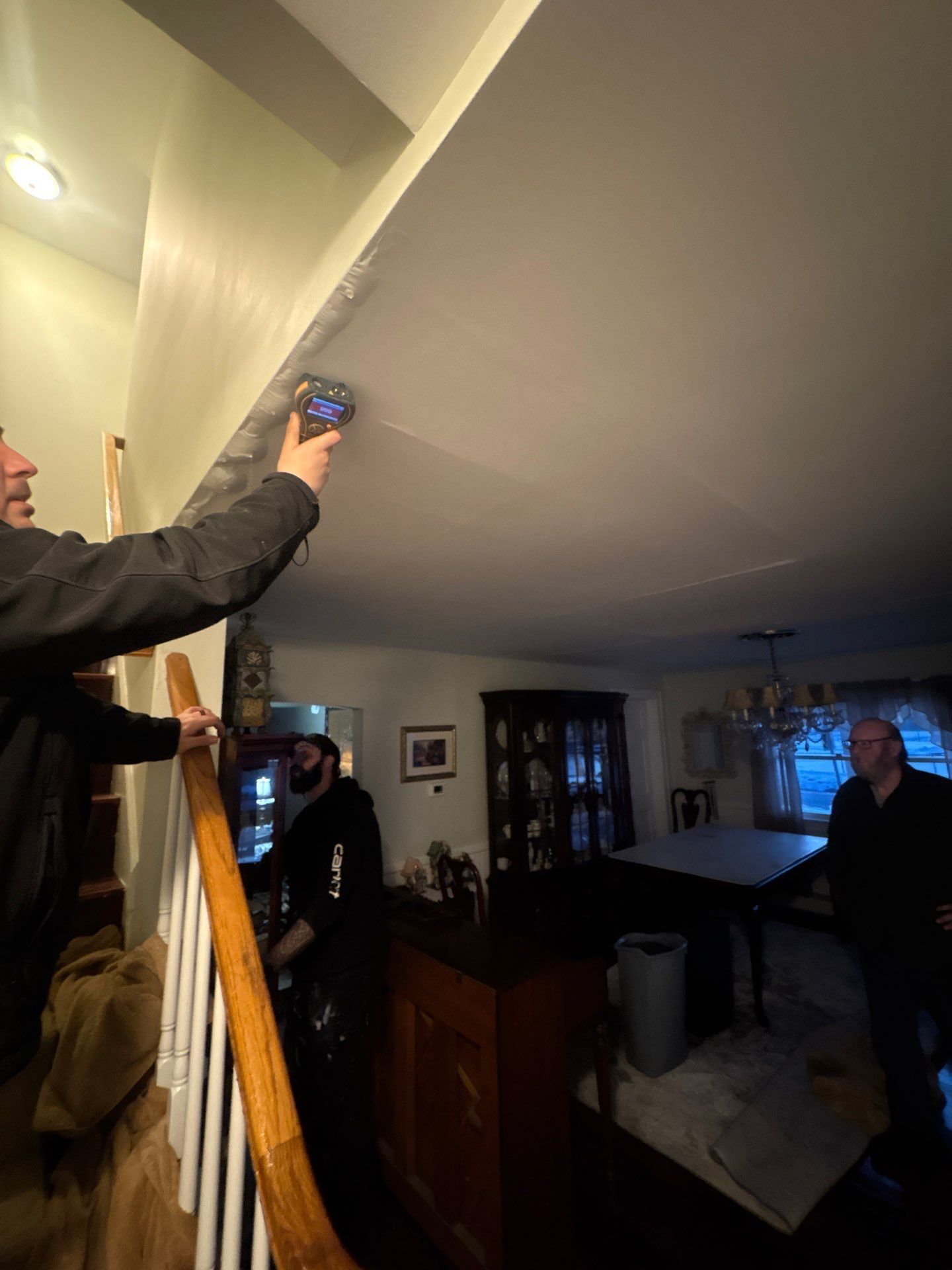 Taking moisture reading inside a home in Patchogue NY