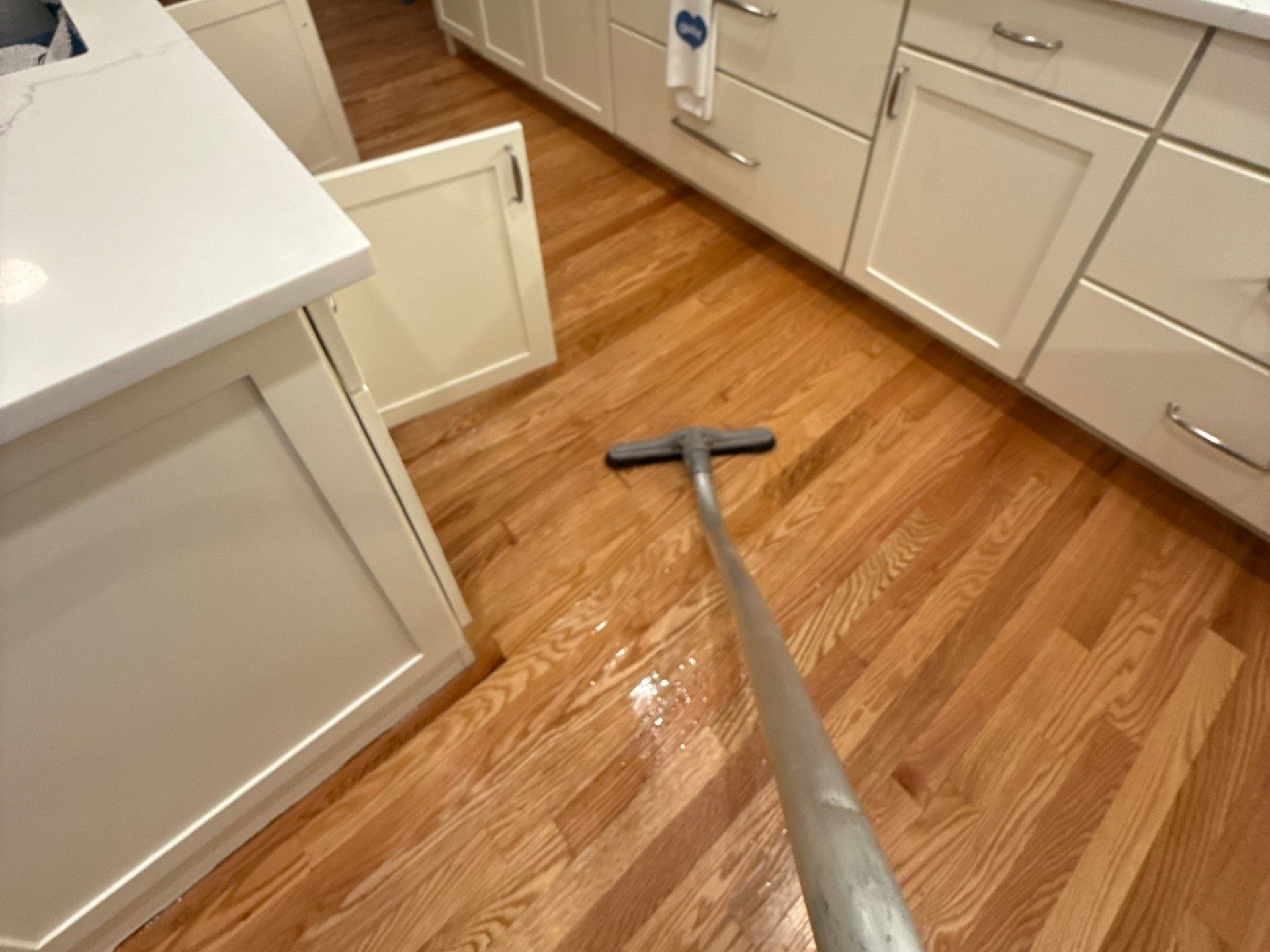extracting water from hardwood flooring as part of the drying process