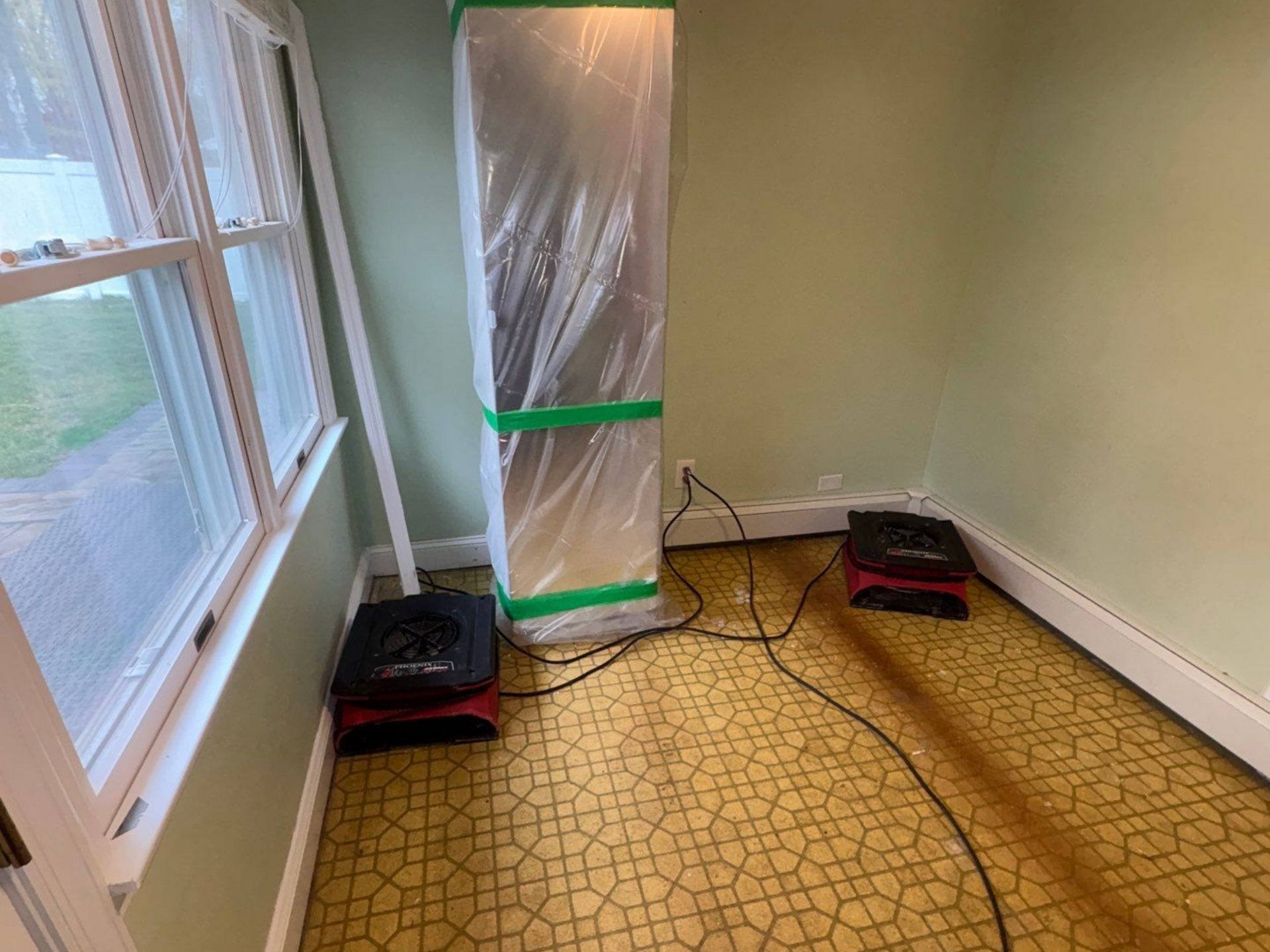 Drying and dehumidifying equipment in contained area of a home in Stony Brook NY