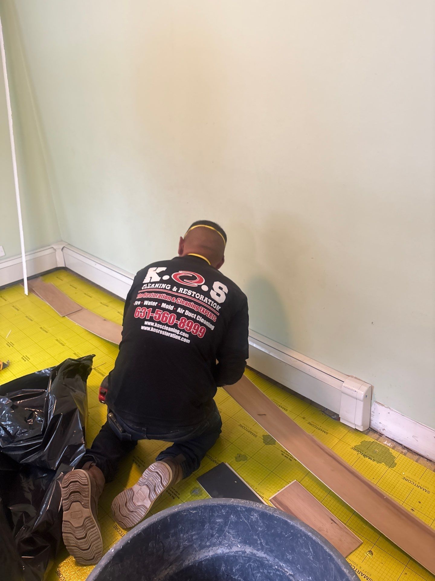 Removing flooring after water damage at a home in Stony Brook NY