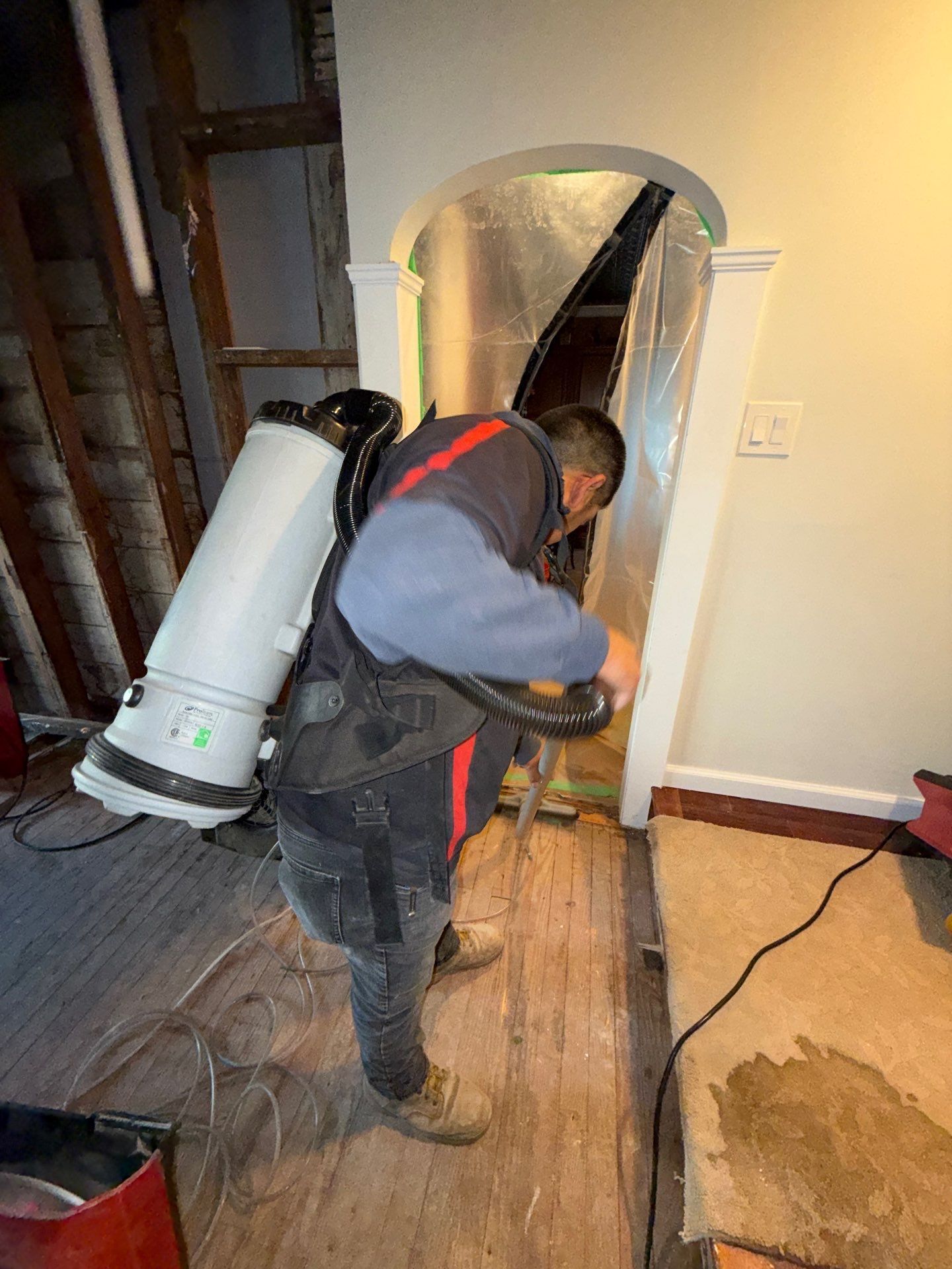 HEPA vacuuming during water damage restoration at a home in Patchogue NY