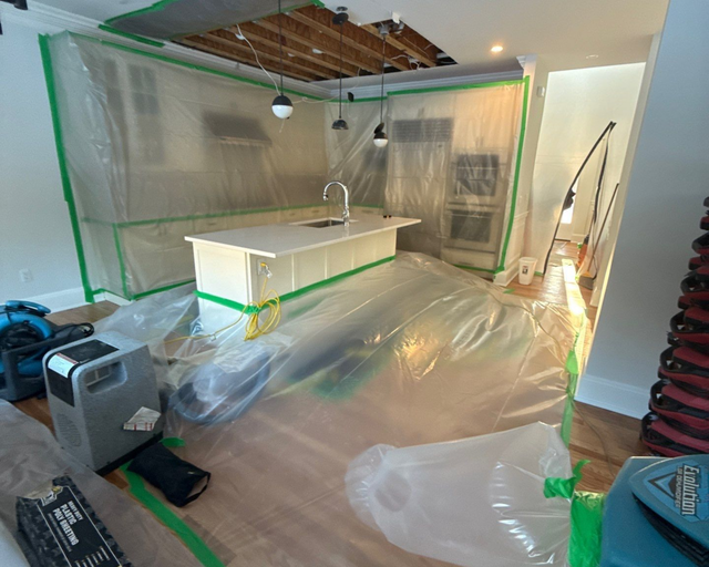 K.O.S. Restoration containment and structural drying equipment set up on a Long Island water-damage job