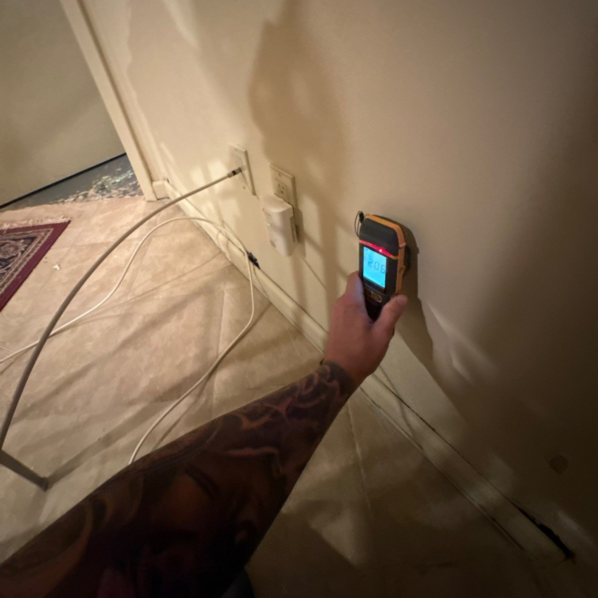 Moisture mapping of basement walls at Glen Head home after water damage.