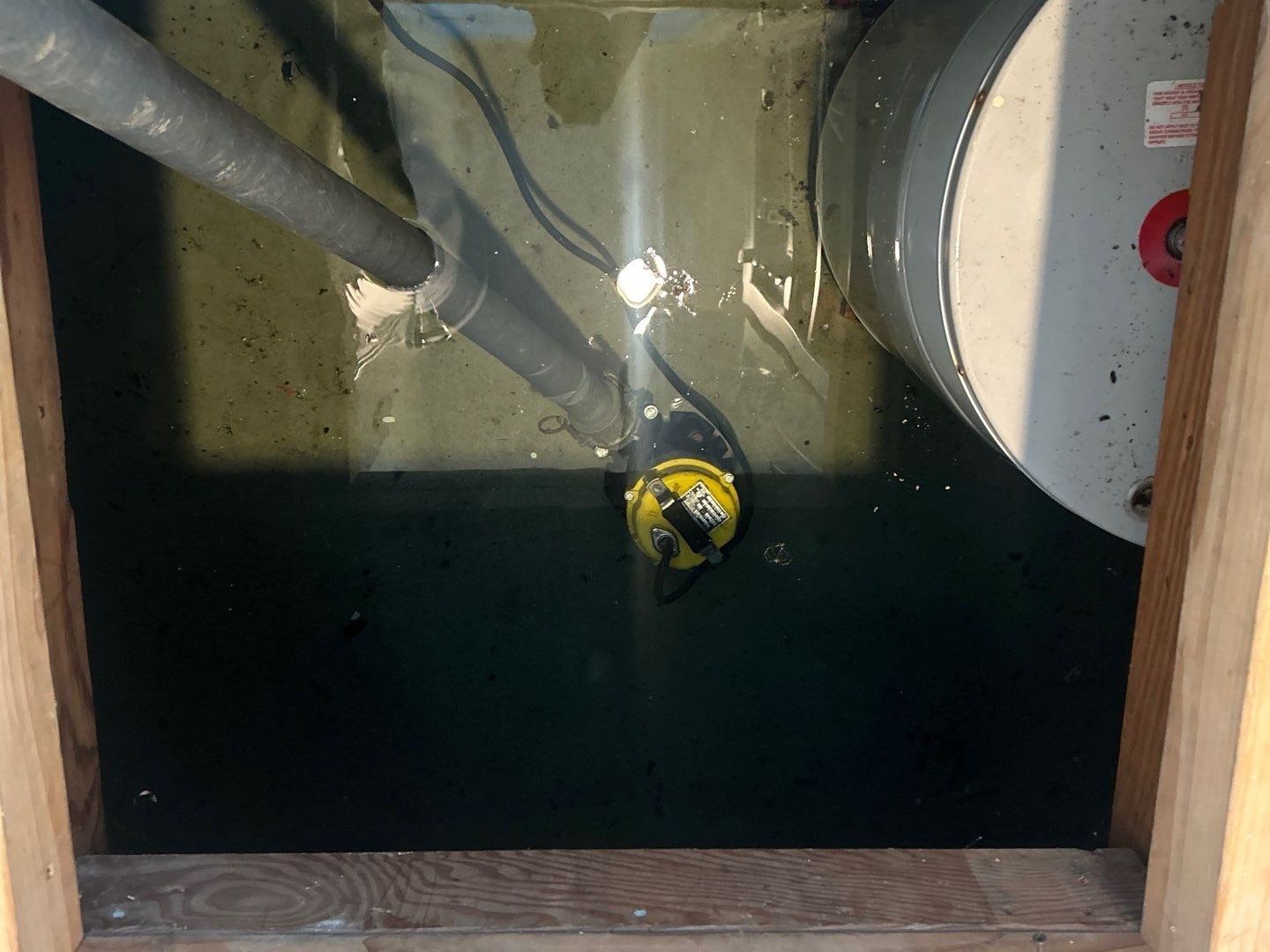 pumping flood water from crawlspace at home in East Hampton NY