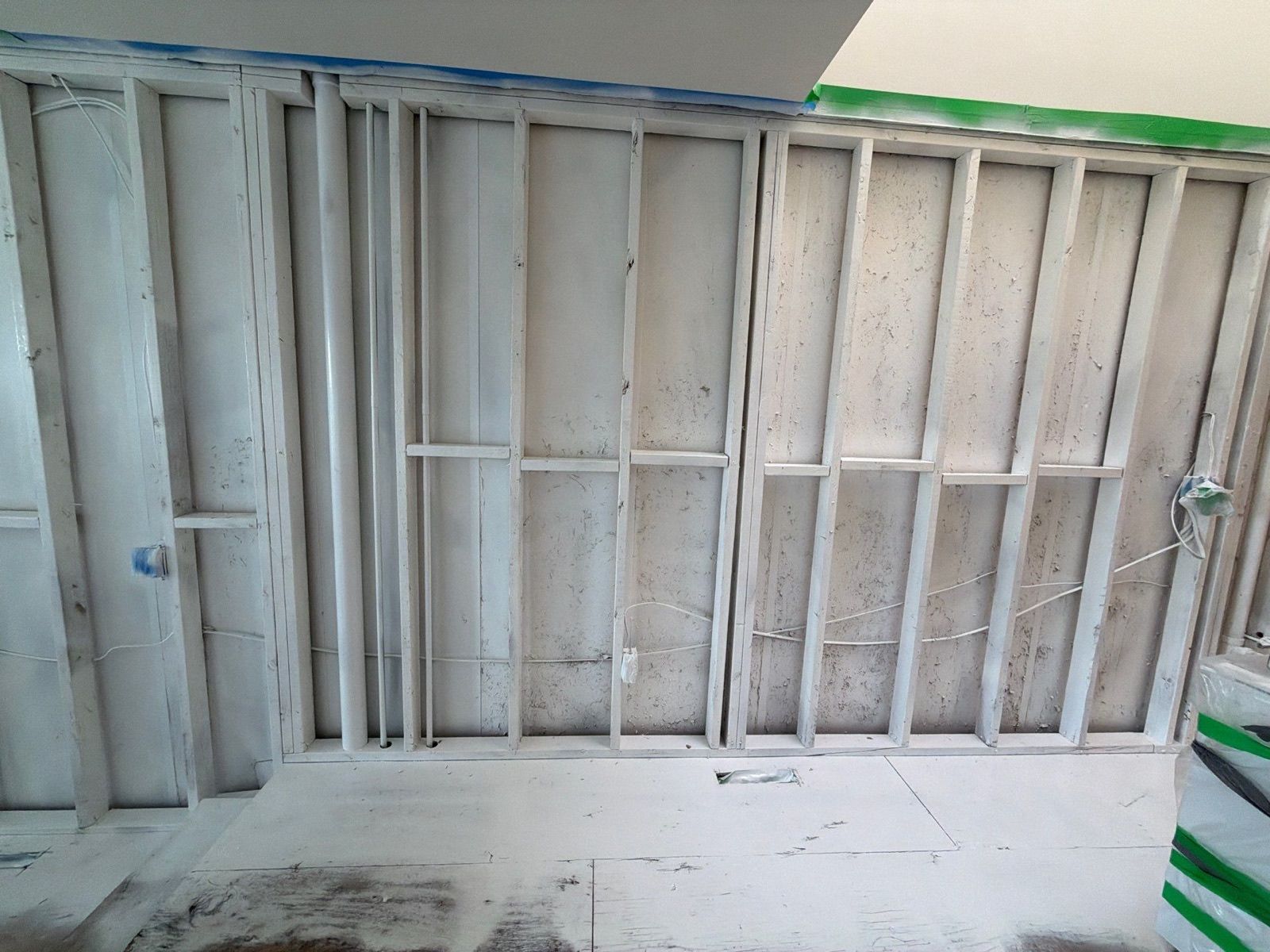 Fully completed wall with mold encapsulation applied at Westhampton Beach home.