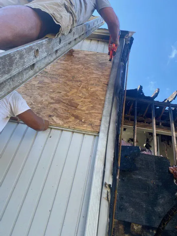 Fire damage restoration boarding of windows by K.O.S.
