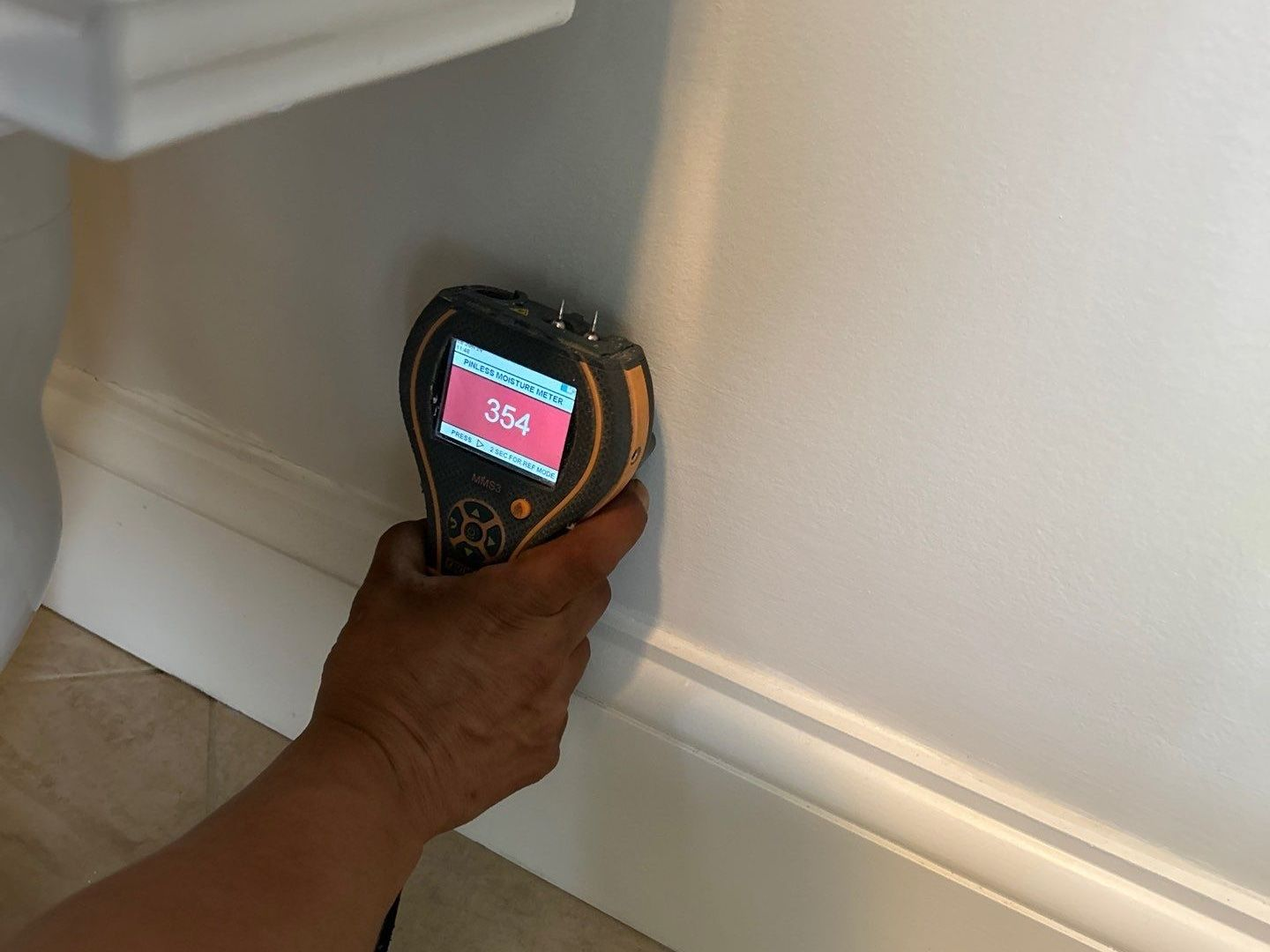 Taking moisture reading at home in East Hampton NY
