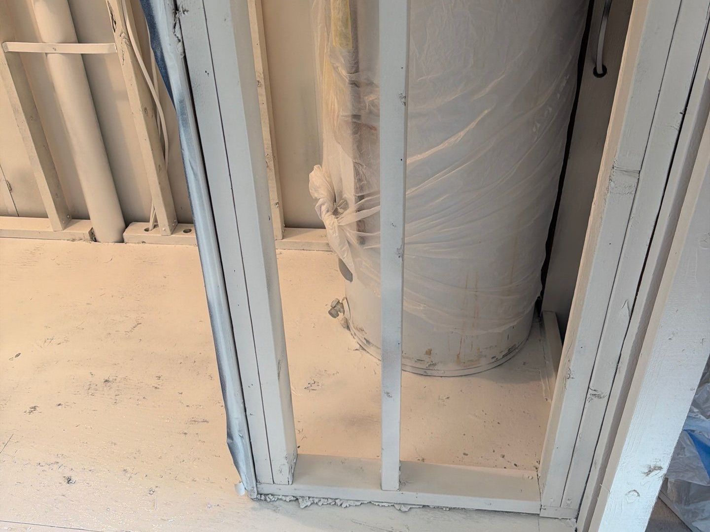 Completed section with mold encapsulation applied after water damage restoration was competed at home in Westhampton Beach