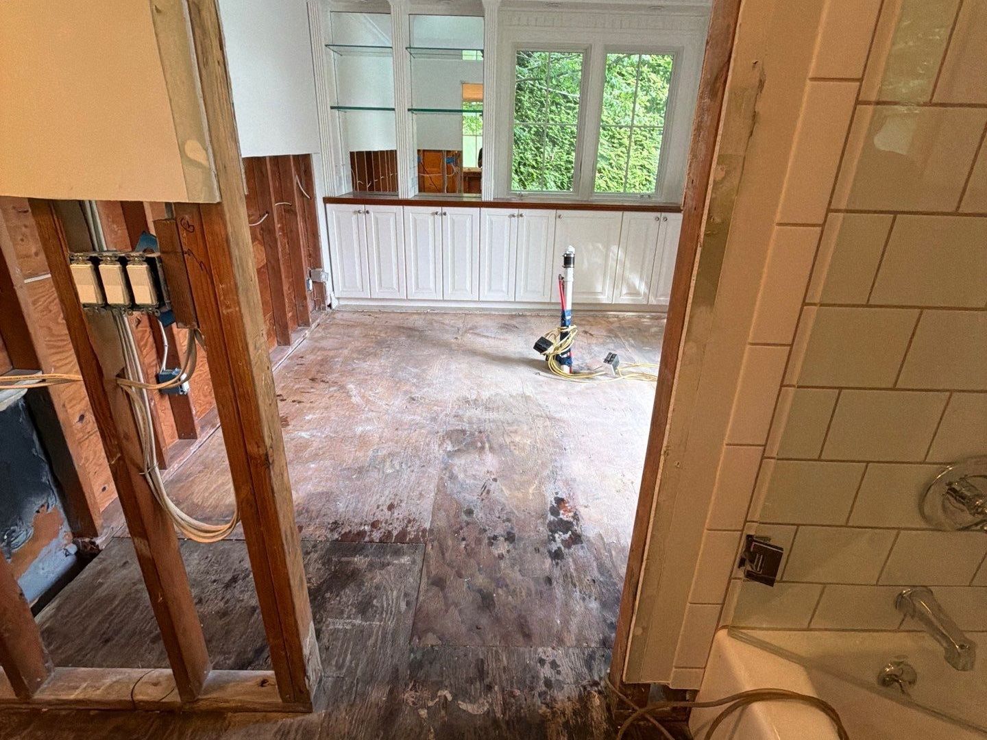 water damaged flooring and drywall removed from pool house