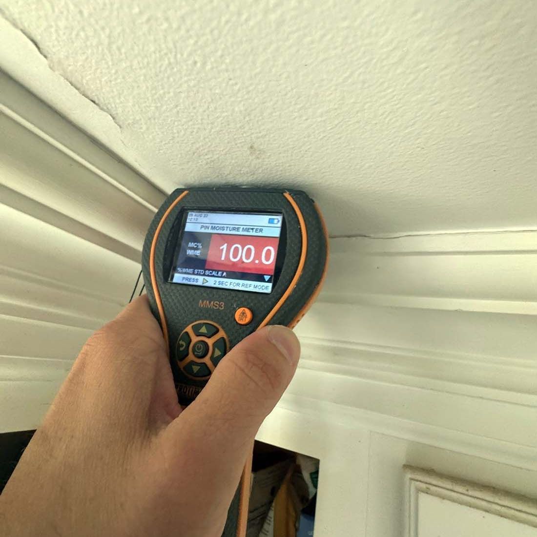 Detecting moisture in ceiling after water damage on Long Island. 