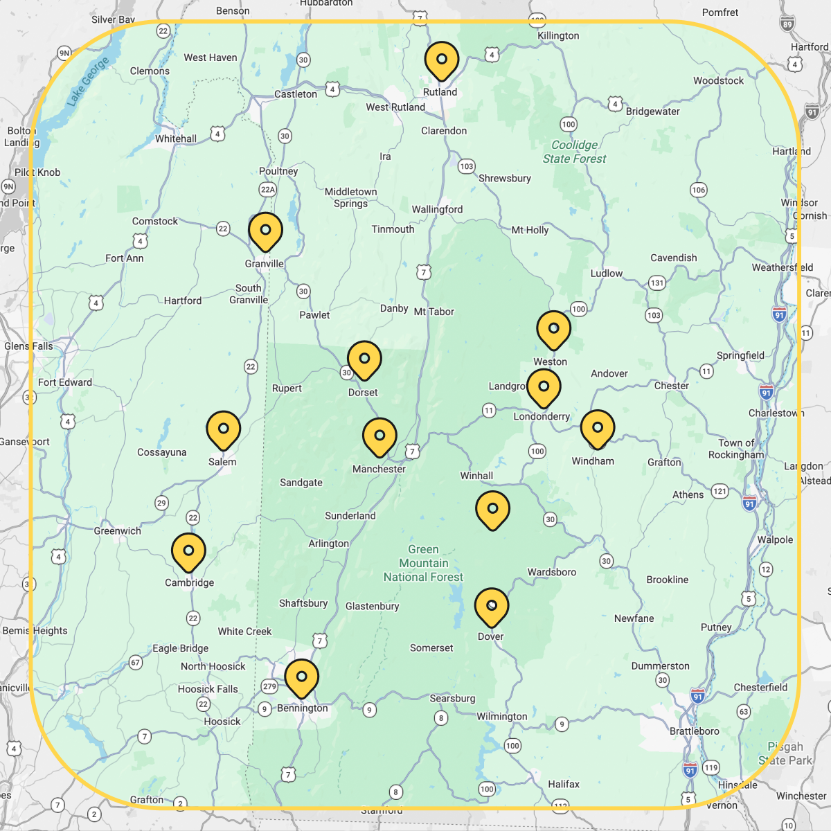 Map with multiple yellow location pins marking points across a green area.
