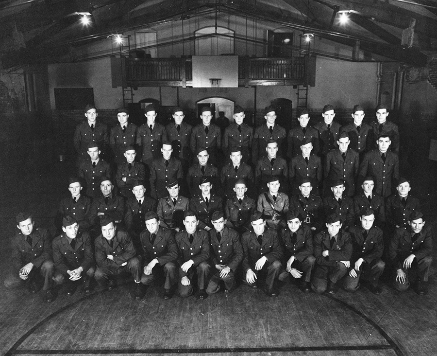 A black and white photo of a group of men in uniform