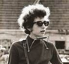 A black and white photo of a woman wearing sunglasses.