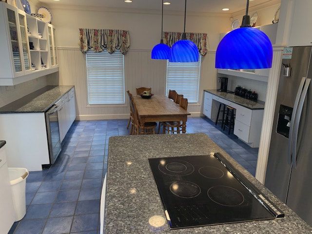 A kitchen with a stove top oven and a table