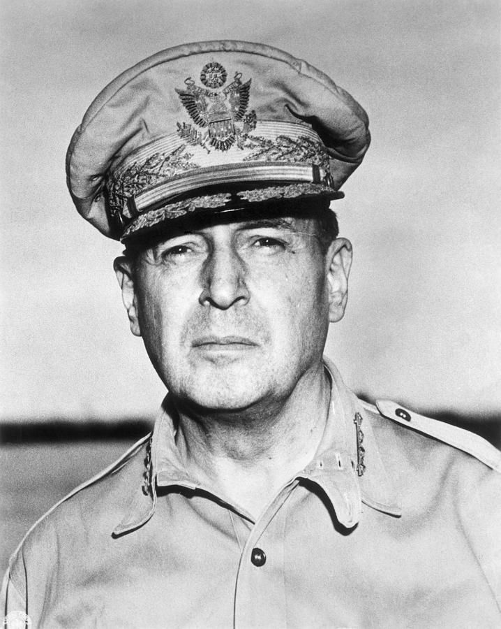 A black and white photo of a man in a military uniform