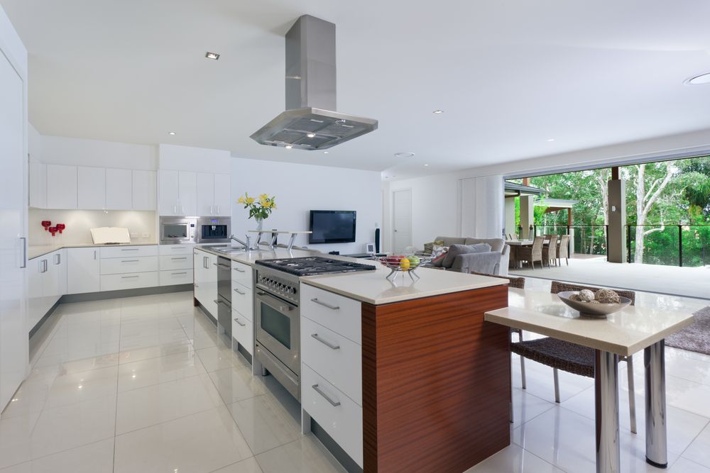 A Kitchen With White Cabinets and Stainless Steel Appliances — Suncoast Kitchens In Kunda Park, QLD