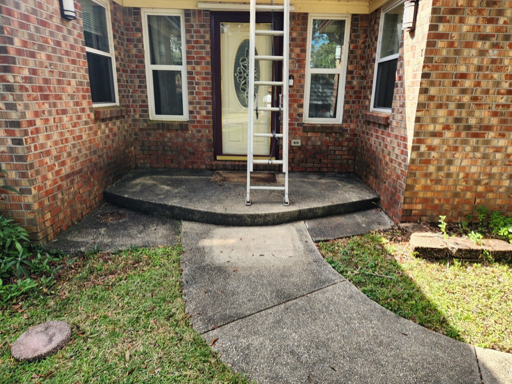 Northwest Florida home exterior showing contrast between clean and salt-stained siding