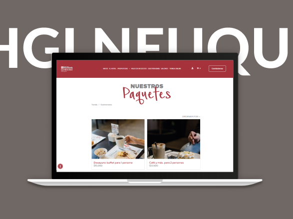 Portátil mostrando la página web de una panadería con encabezado rojo y fotos de pasteles en pantalla.