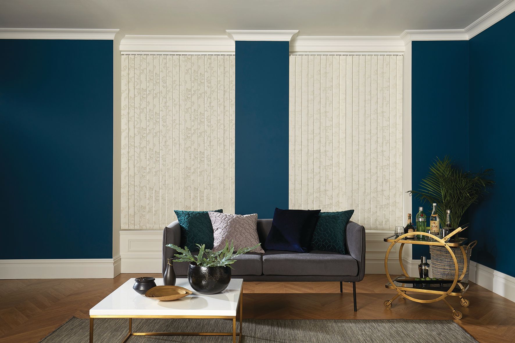 Living room with blue walls, beige blinds, a gray sofa, and a marble coffee table. Abundance Blinds In Charmhaven, NSW