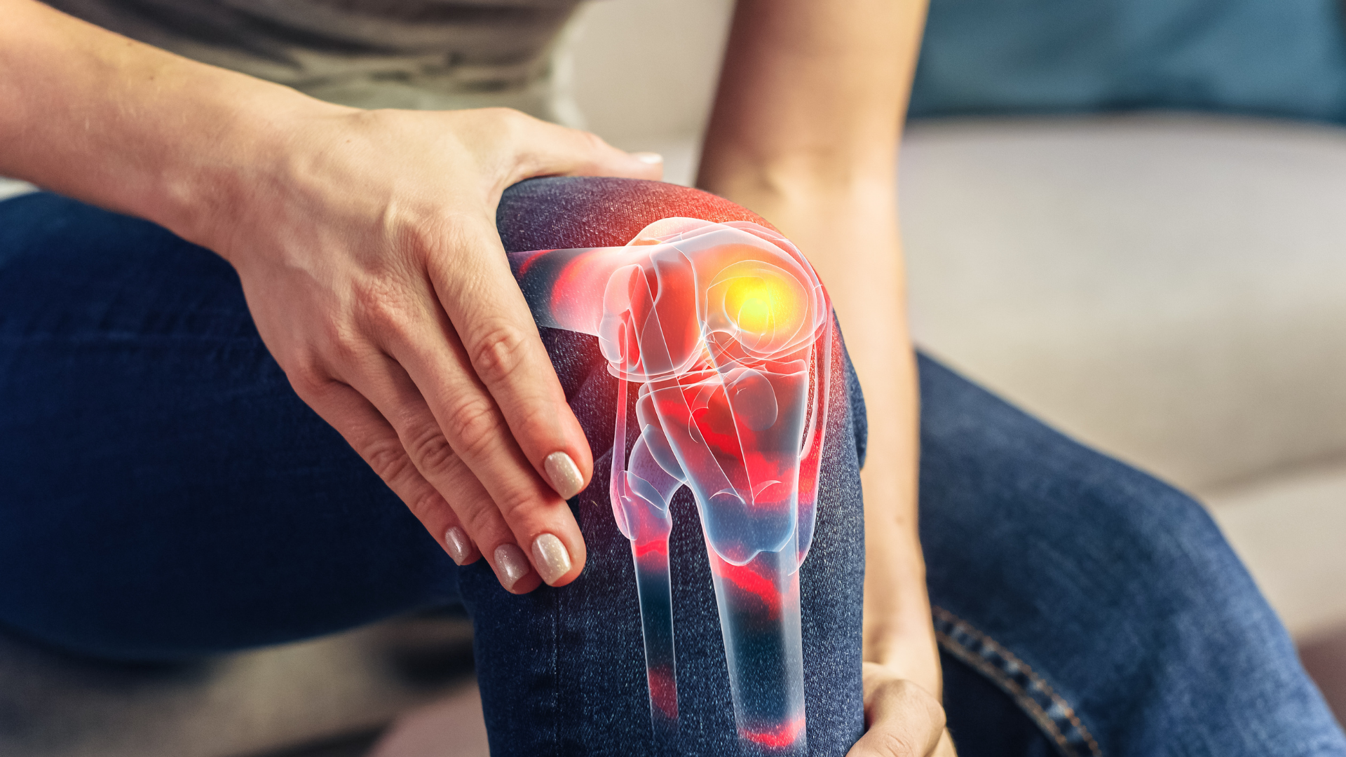 Hand holding a knee with glowing red pain overlay, suggesting a joint injury or inflammation